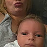 baby, infant, adult, mother, portrait, selfie, indoors, couch, seated, face, eyes, blonde_hair, duck_face, onesie, baby_clothing, close_up, family, home, photograph, calm