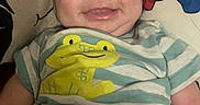 Josiah joined the competition — help win amazing prizes! baby, infant, child, smiling, portrait, indoors, bed, pillow, spiderman, superhero, frog_shirt, striped_clothing, diaper, seated, happy, face, blond_hair, blue_eyes, cozy, photography