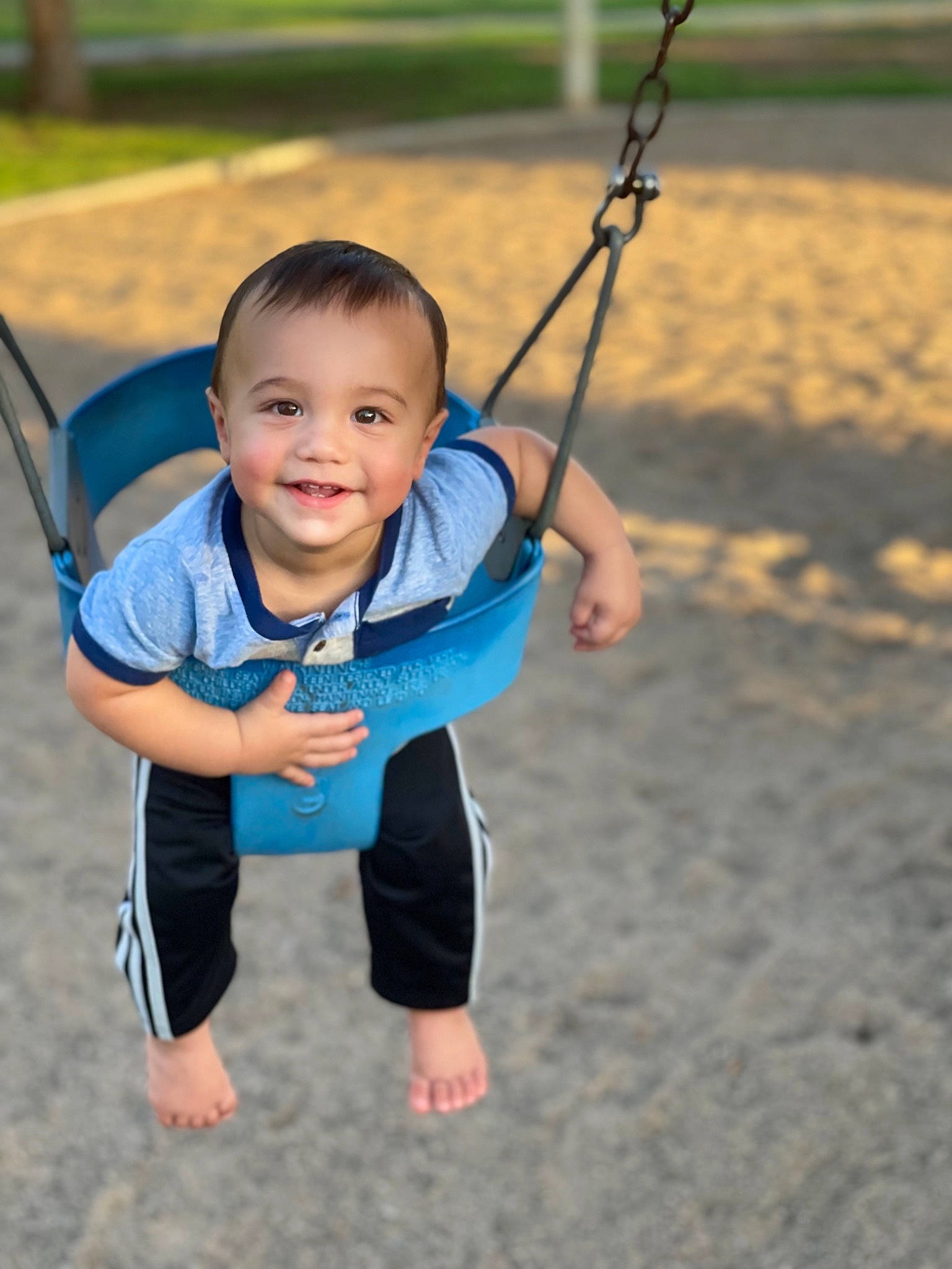 Ashter joined the competition — help win amazing prizes! arm, baby, baby_toddler_clothing, face, fun, grass, hand, happy, joy, leisure, outdoor_play_equipment, people_in_nature, person, plant, playground, skin, sleeve, smile, swing, t_shirt