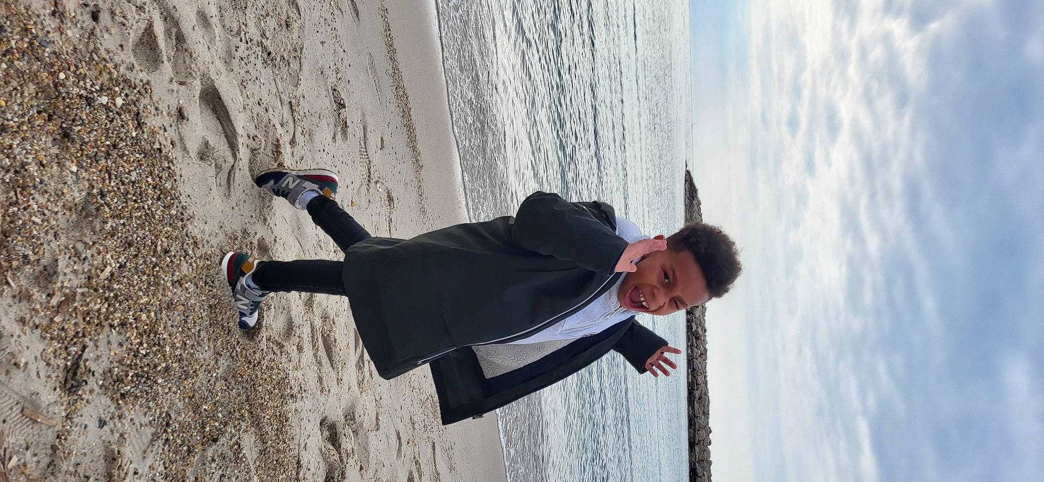 Ethan participe au concours pour gagner de l'argent avec cette photo : adventure, anger, beach, cloud, eyewear, fun, glasses, happy, leisure, ocean, person, recreation, sand, shadow, sky, smile, sunglasses, tree, vacation, water