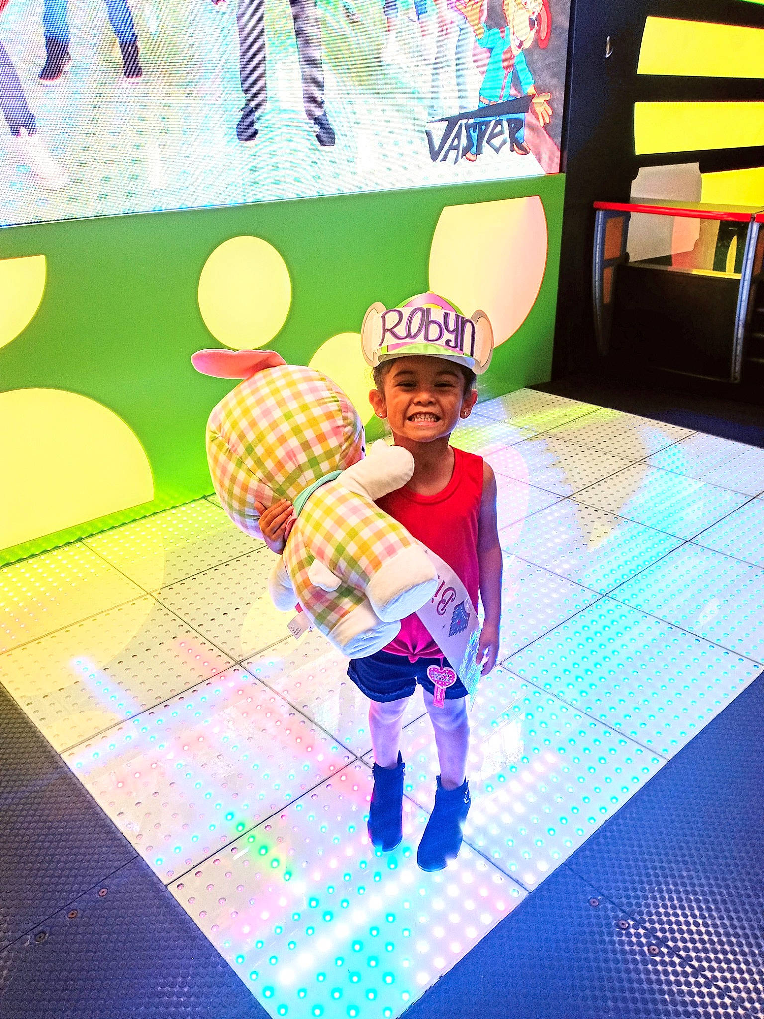 Robyn joined the competition — help win amazing prizes! animation, balloon, entertainment, event, flooring, fun, graphic_design, happy, headwear, joy, leisure, magenta, party_supply, pattern, person, play, purple, recreation, smile, toddler