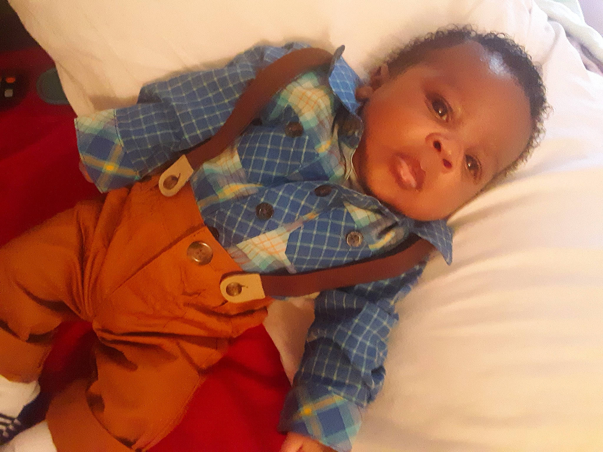 Daedae is registered to the contest to win money with this photo: baby, cheek, child, head, person, plaid, skin, textile, toddler