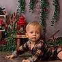 toddler, child, plaid_clothing, floor, indoor, greenery, red_berries, lantern, wooden_stool, vines, serious_expression, blonde_hair, cute, portrait, decor, natural_light, crawling, baby, home, cozy