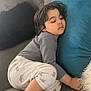 Kenzo joined the competition — help win amazing prizes! blue_cushion, child, comfort, cozy, curly_hair, cushion, cute, furniture, home, indoor, nap, pajamas, peaceful, plush, relaxing, resting, sleeping, sofa, striped_socks, toddler