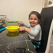 Kenzo joined the competition — help win amazing prizes! bowl, carpet, chair, child, clothing, decor, face, furniture, hair, hand, happy, indoor, person, plate, shelf, smiling, snack, table, toddler, wall