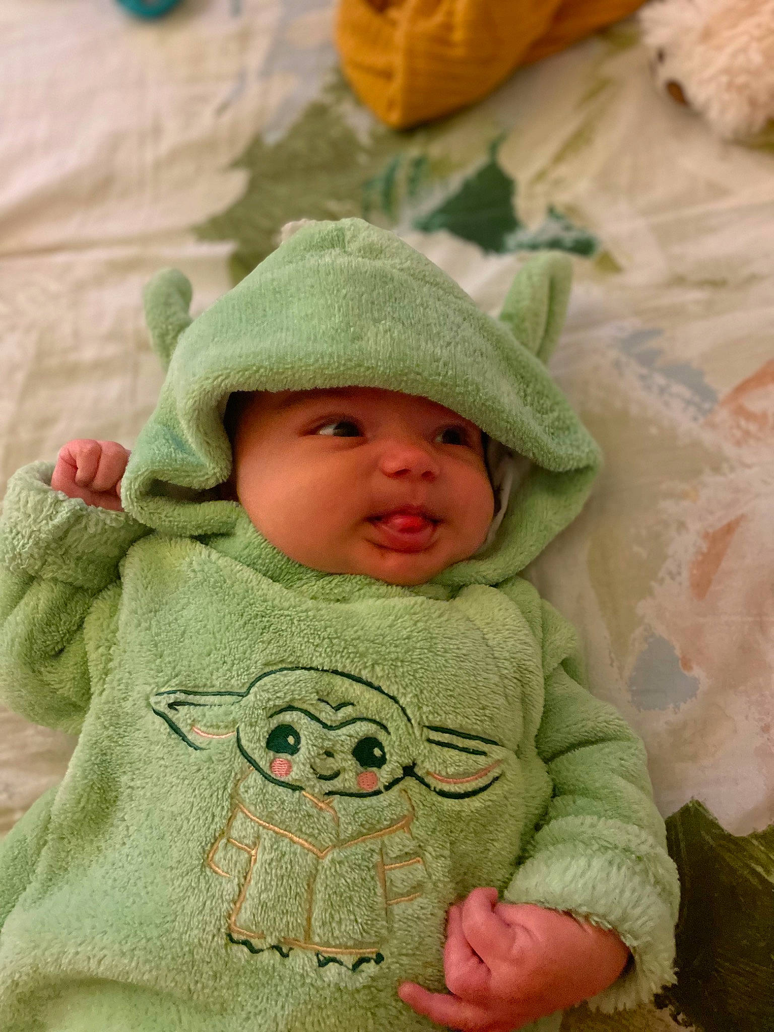 Emberly joined the competition — help win amazing prizes! baby, baby_sleeping, baby_toddler_clothing, cap, cheek, child, comfort, face, facial_expression, grass, happy, headwear, hoodie, linens, outerwear, pattern, person, skin, sleeve, textile