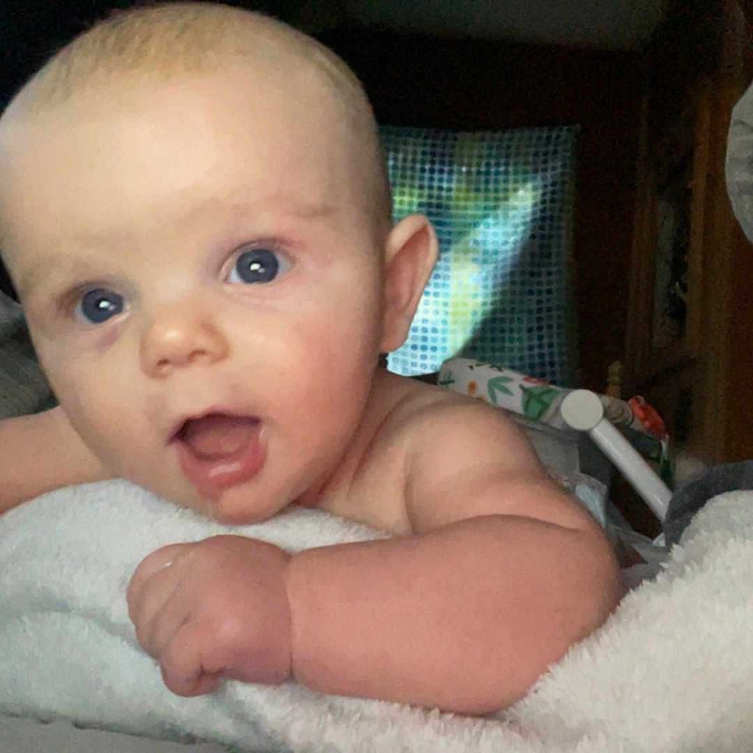 Jacob is registered to the contest to win money with this photo: architecture, baby, barefoot, bed, bedroom, blanket, bodypart, building, chair, clothing, couch, crib, cushion, diaper, dress, face, finger, furniture, hand, happy