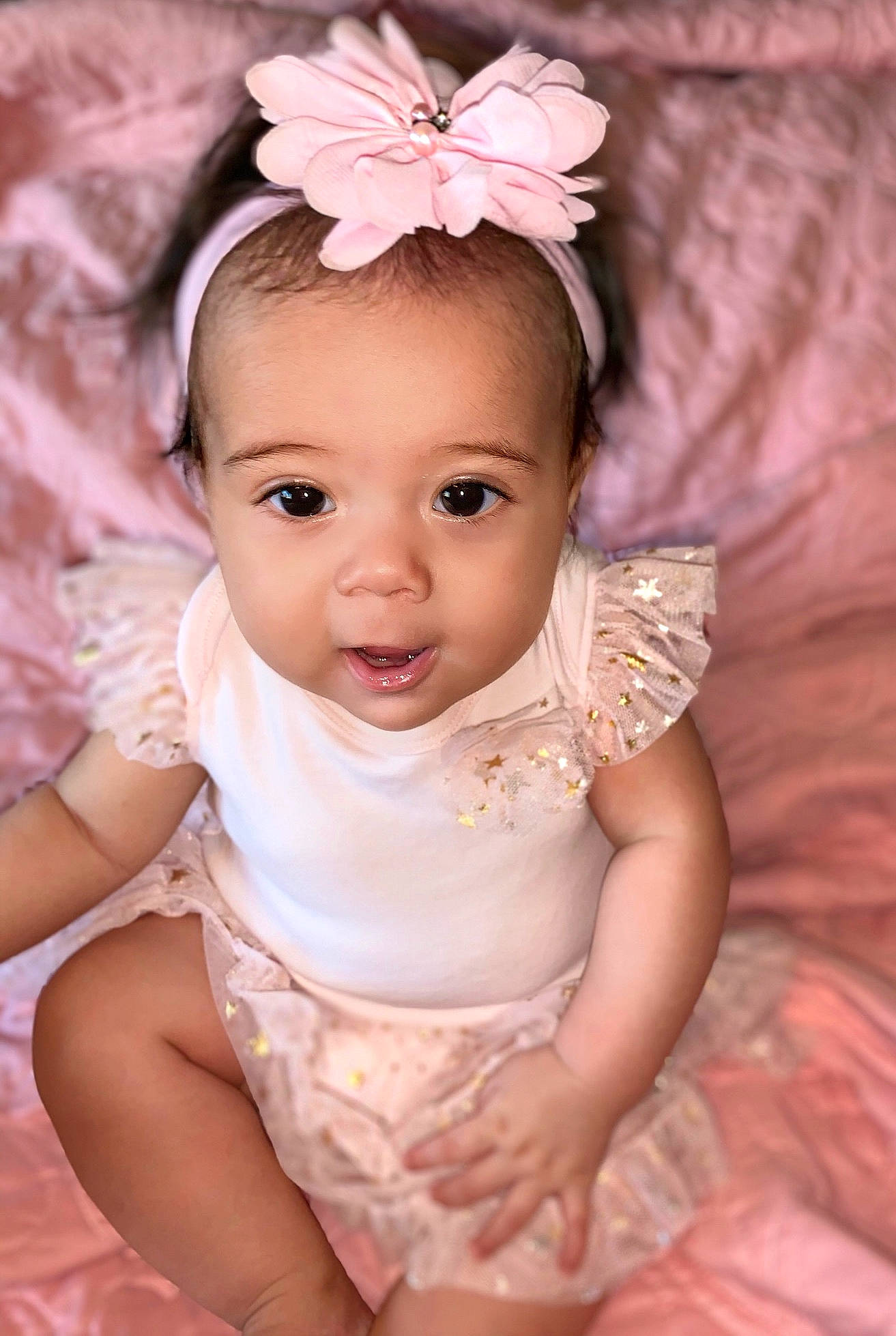 Emerey joined the competition — help win amazing prizes! baby, baby_toddler_clothing, cheek, child, child_model, eye, face, fashion_accessory, hair_accessory, head, headband, headgear, headpiece, iris, person, photography, pink, product, skin, smile