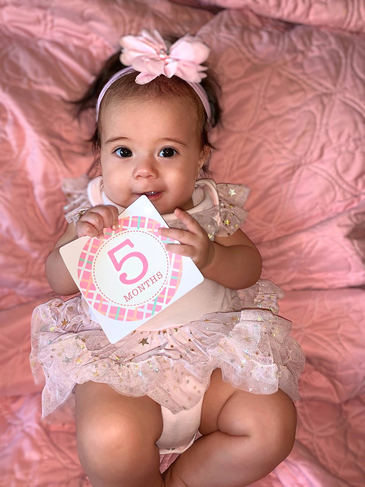 Emerey is registered to the contest to win money with this photo: baby, baby_products, baby_toddler_clothing, cheek, child, hair_accessory, happy, person, pink, product, skin, smile, sweetness, toddler