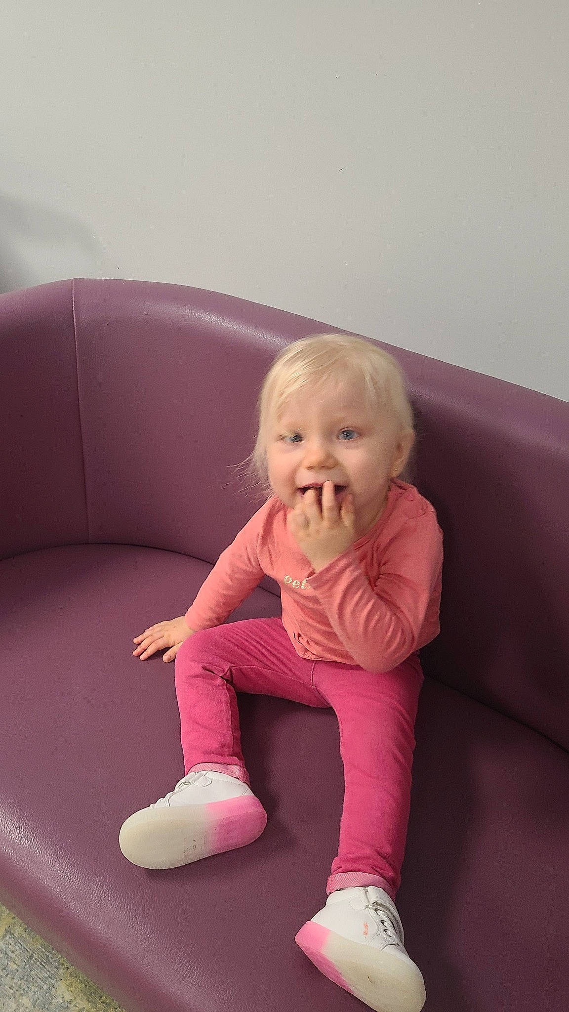 Kaysee participe au concours pour gagner de l'argent avec cette photo : arm, baby, baby_toddler_clothing, cheek, comfort, couch, eye, face, finger, flooring, fun, head, knee, magenta, person, pink, skin, sleeve, smile, thigh