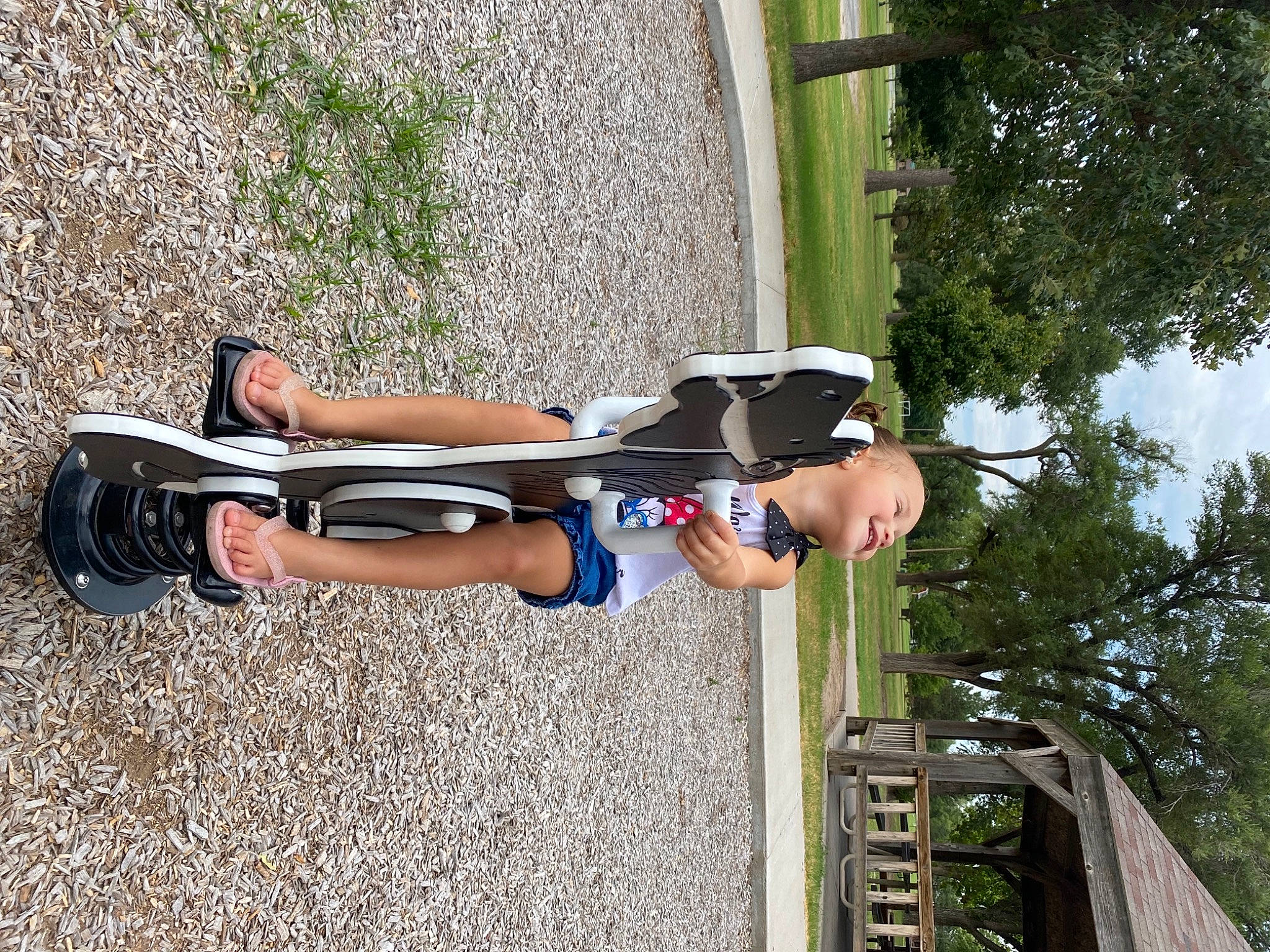 Amalia is registered to the contest to win money with this photo: asphalt, auto_part, bicycle_handlebar, elbow, electric_blue, fun, helmet, human_leg, knee, leg, leisure, person, personal_protective_equipment, plant, recreation, shorts, sky, thigh, tree