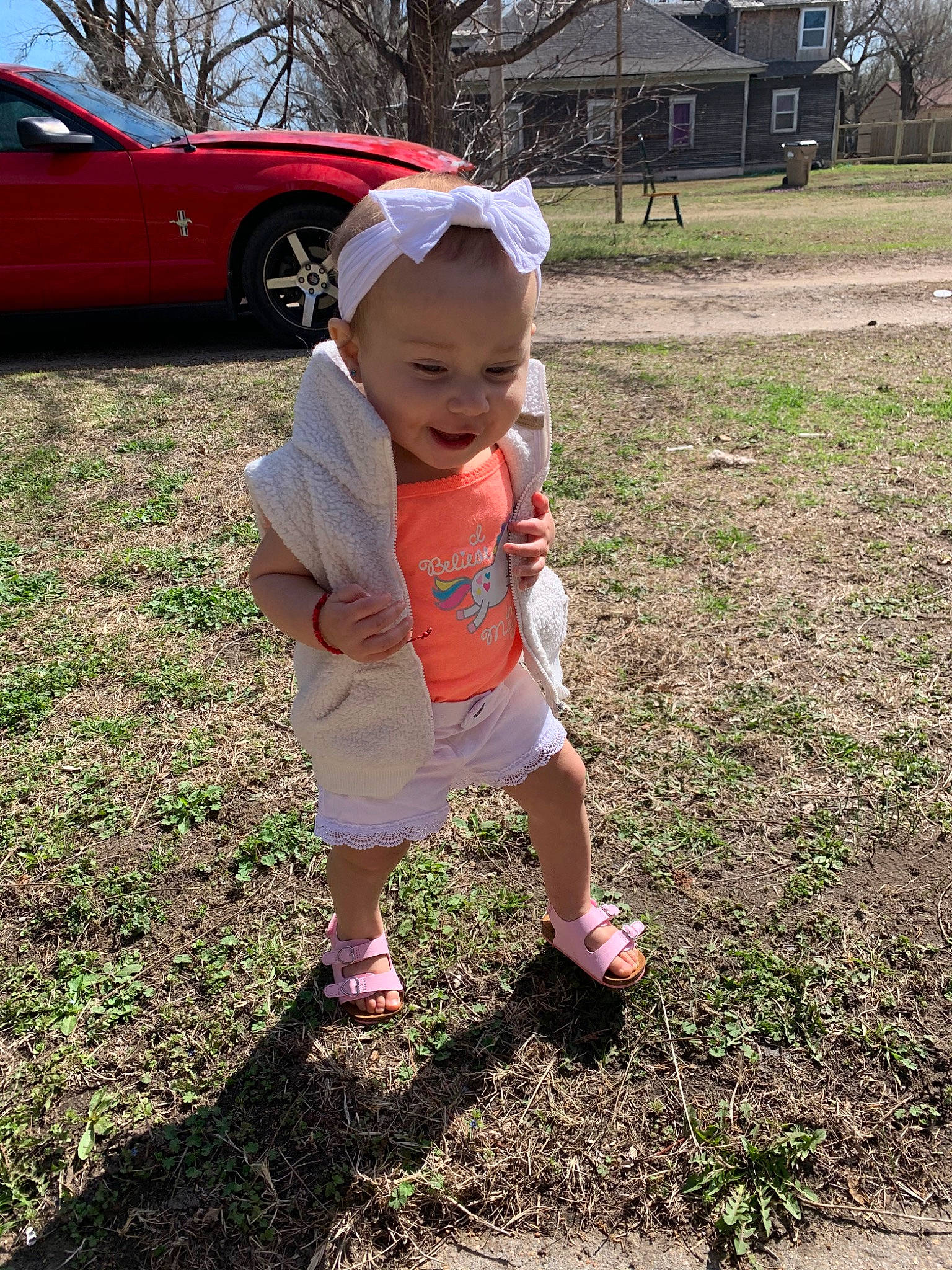 Amalia is registered to the contest to win money with this photo: adaptation, car, child, fun, grass, person, plant, play, smile, soil, toddler, tree, vacation, vehicle