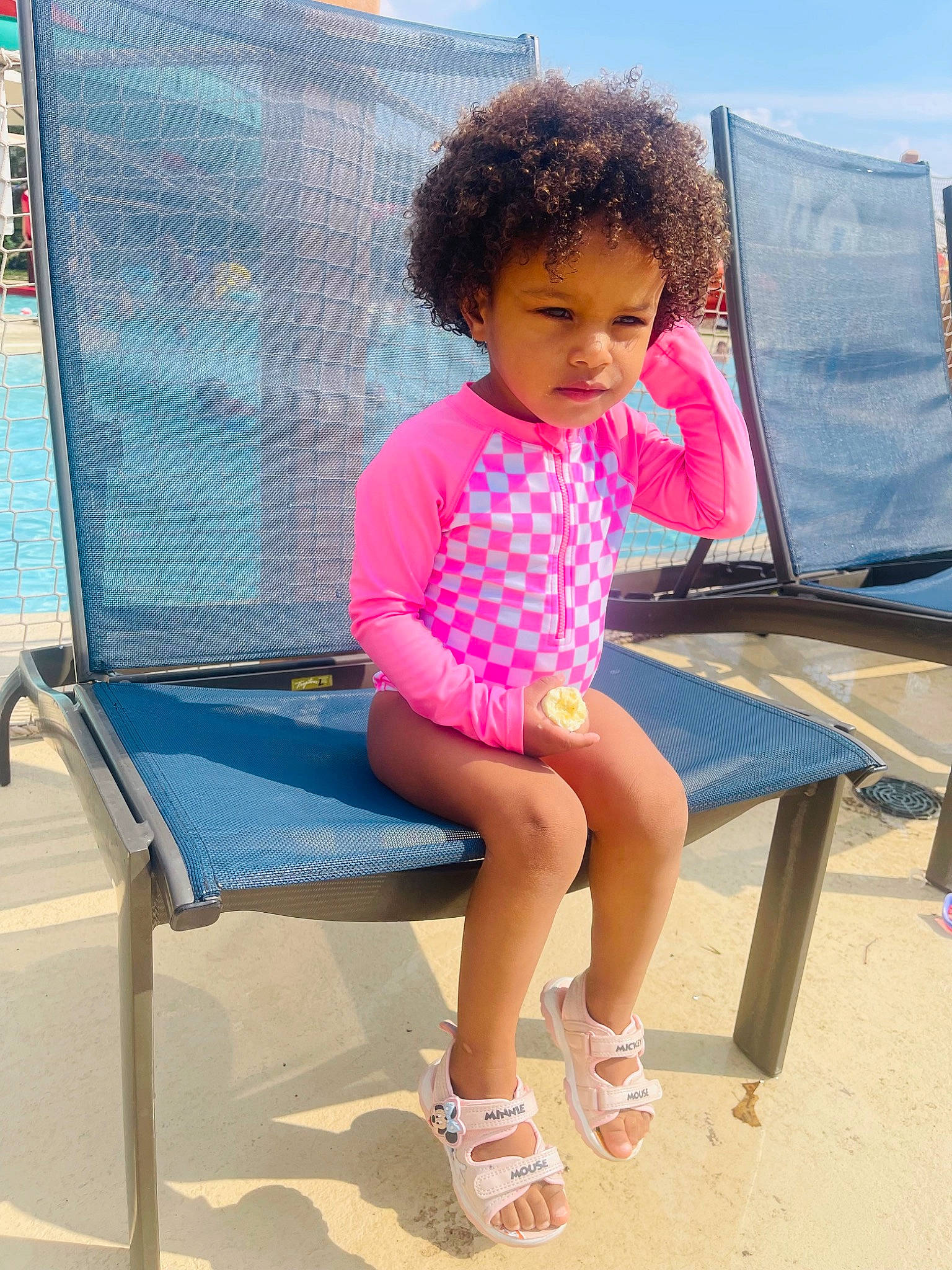 Arabella joined the competition — help win amazing prizes! baby_toddler_clothing, child, electric_blue, foot, fun, human_leg, leisure, magenta, outdoor_furniture, person, play, public_space, recreation, sandal, shade, shorts, sitting, sky, thigh, toddler