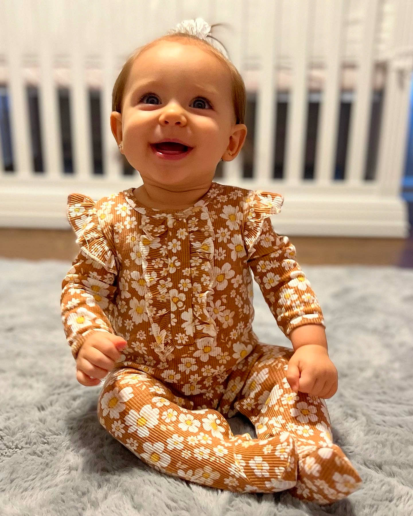 Avalee joined the competition — help win amazing prizes! baby, baby_toddler_clothing, cheek, child, collar, dress, face, flooring, fun, happy, head, laugh, magenta, pattern, peach, person, portrait_photography, sitting, sleeve, smile
