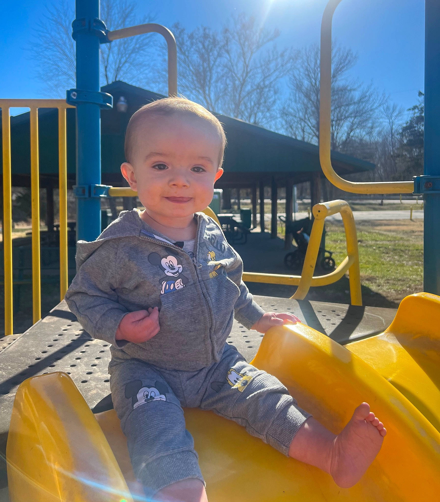 Christopher joined the competition — help win amazing prizes! baby_toddler_clothing, child, city, electric_blue, facial_expression, fun, grass, happy, leisure, motor_vehicle, outdoor_play_equipment, person, playground, recreation, sitting, sky, smile, t_shirt, toddler, travel