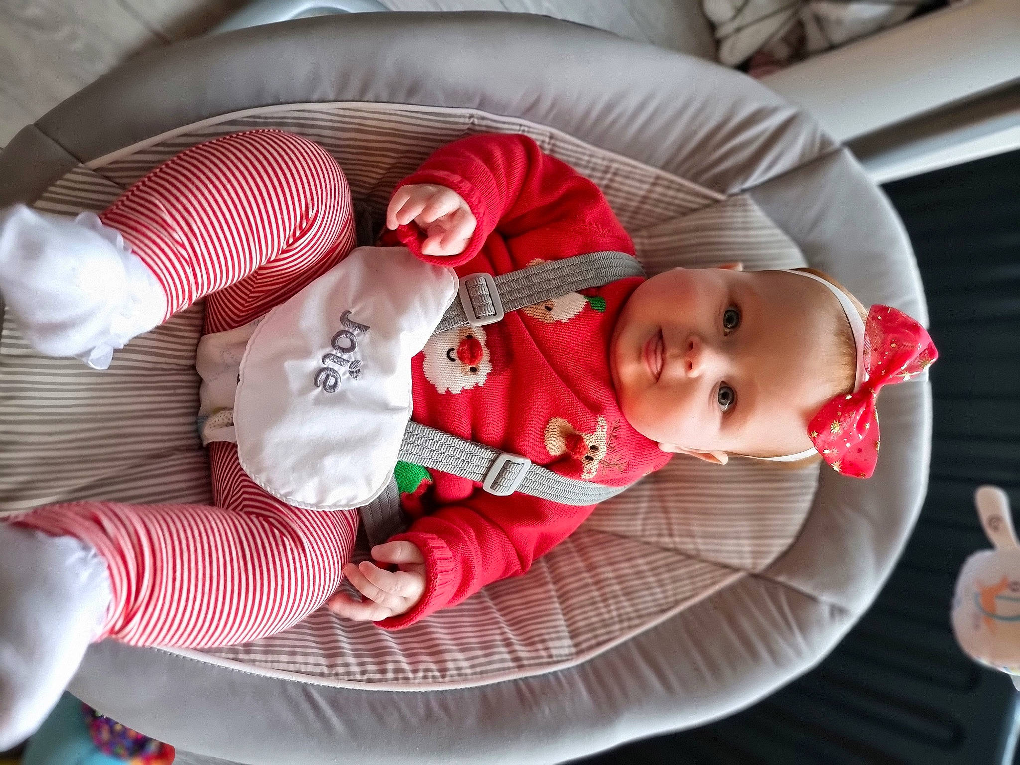 Skye is registered to the contest to win money with this photo: baby, baby_carriage, baby_in_car_seat, baby_products, baby_toddler_clothing, car_seat, carmine, child, comfort, event, finger, hand, lap, linens, pattern, person, product, sitting, sleeve, sock