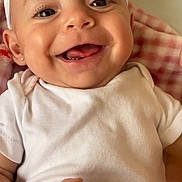 Zavia joined the competition — help win amazing prizes! baby, smiling, infant, white_clothing, headband, cute, happy, portrait, closeup, child, skin, hand, person, young, face, indoors, laying, blanket, soft, expression