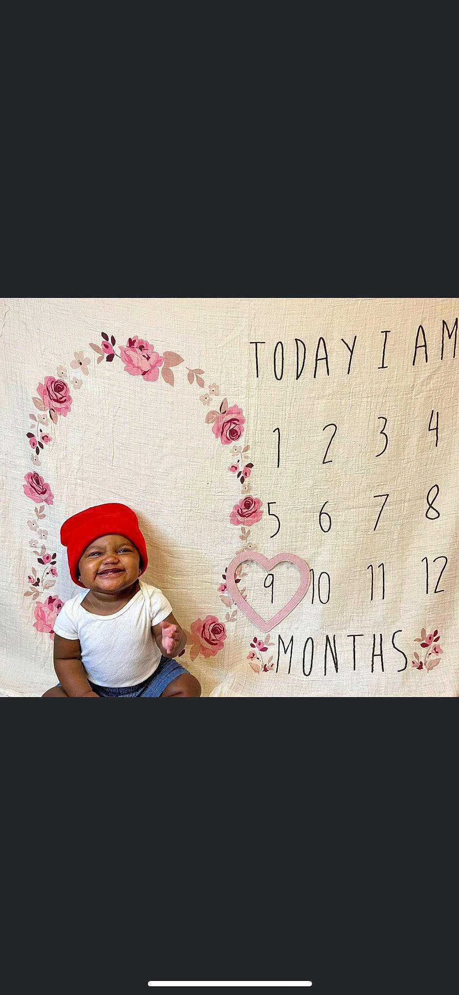 Kalaya is registered to the contest to win money with this photo: baby_toddler_clothing, beanie, cap, cloud, costume_hat, event, fashion_accessory, font, happy, hat, headwear, holiday, joy, love, magenta, pattern, person, petal, pink, sleeve