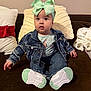 Mia is registered to the contest to win money with this photo: baby, child, denim_jacket, jeans, bow, headband, sneakers, couch, pillow, blanket, indoor, cute, fashion, sitting, portrait, clothing, footwear, infant, face, person
