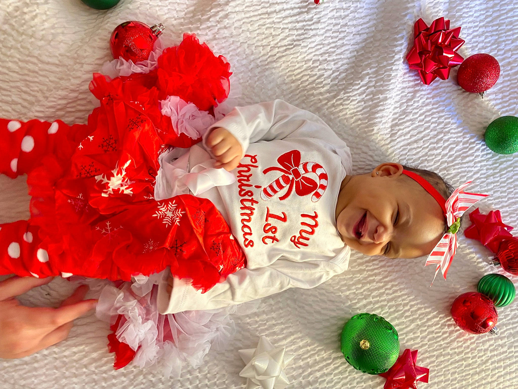 Amyah is registered to the contest to win money with this photo: baby, baby_toddler_clothing, carmine, child, dress, event, fashion_accessory, happy, headpiece, holiday, pattern, peach, person, petal, plant, product, red, sleeve, smile, textile