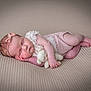 Maya-Rae joined the competition — help win amazing prizes! baby, sleeping, infant, pink_clothing, bow, teddy_bear, knitted_toy, blanket, soft_texture, peaceful, cute, portrait, resting, child, newborn, hand, foot, headband, closeup, indoor