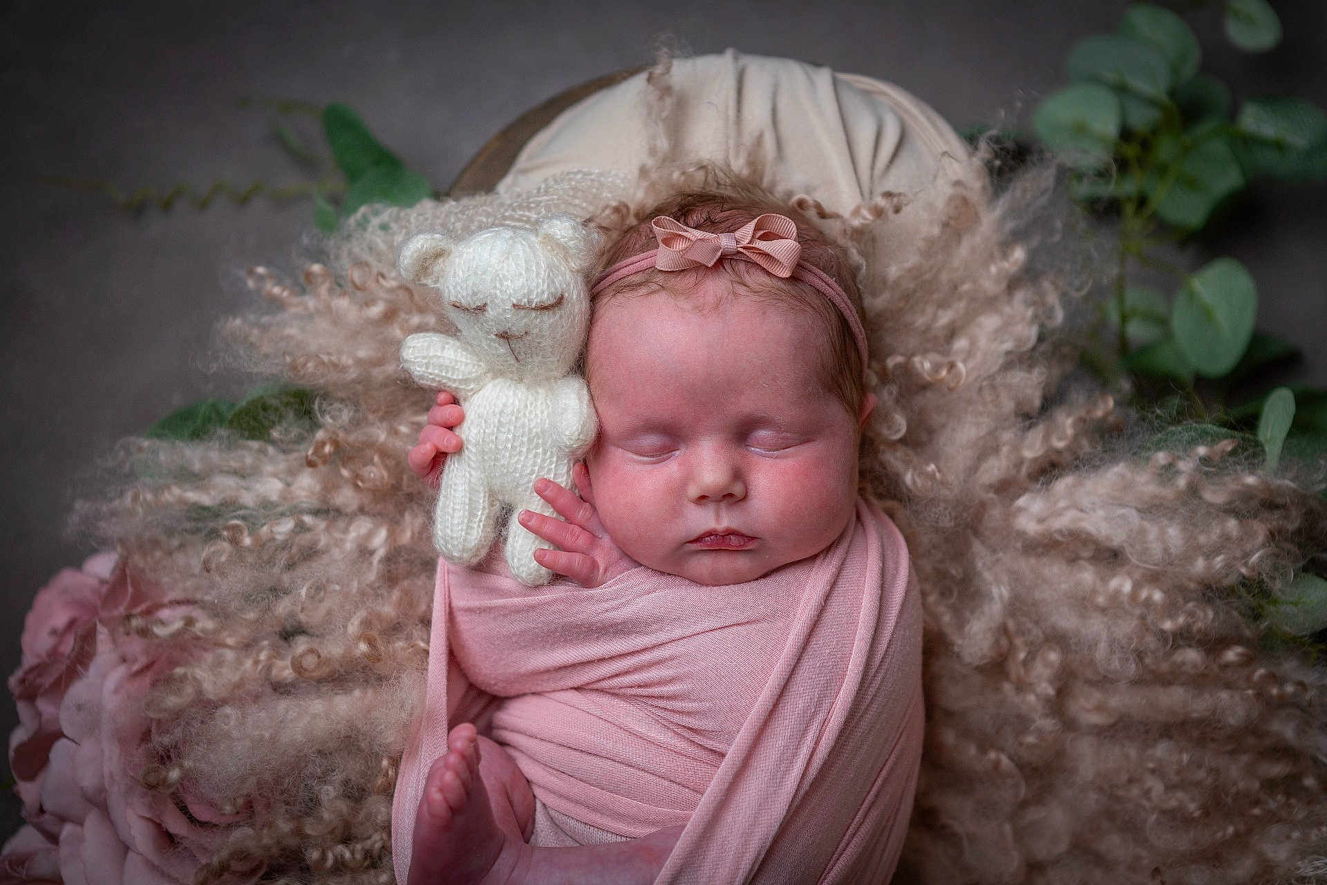 Maya-Rae joined the competition — help win amazing prizes! newborn, baby, sleeping, pink_wrap, knitted_toy, teddy_bear, curly_fur, soft_texture, headband, peaceful, infant, portrait, cuddly, cute, resting, wrapped, flower, greenery, closeup, adorable