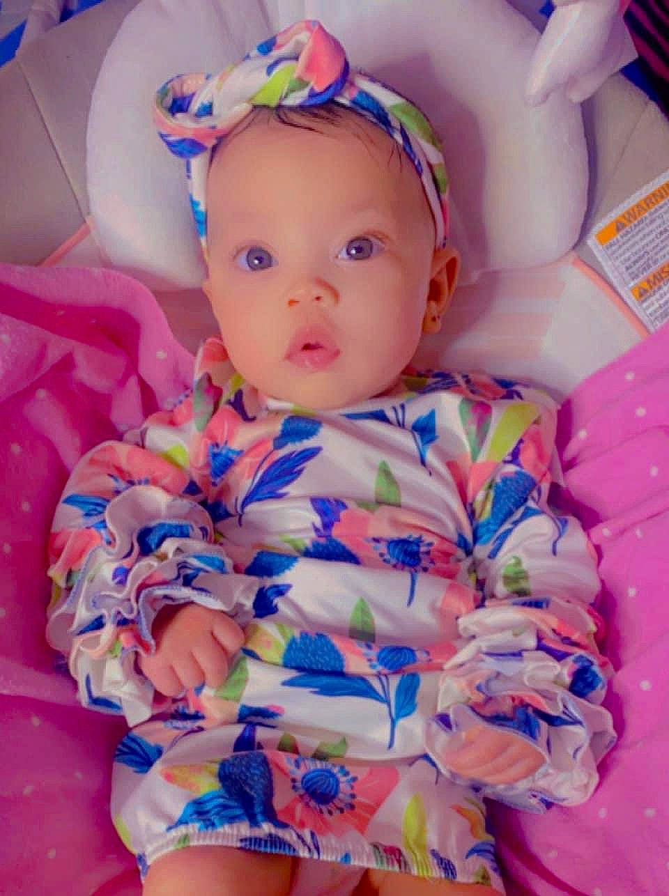 Kaisley is registered to the contest to win money with this photo: baby, baby_toddler_clothing, cheek, eye, face, facial_expression, fun, happy, head, iris, magenta, nose, person, pink, product, purple, skin, sleeve, textile, toddler