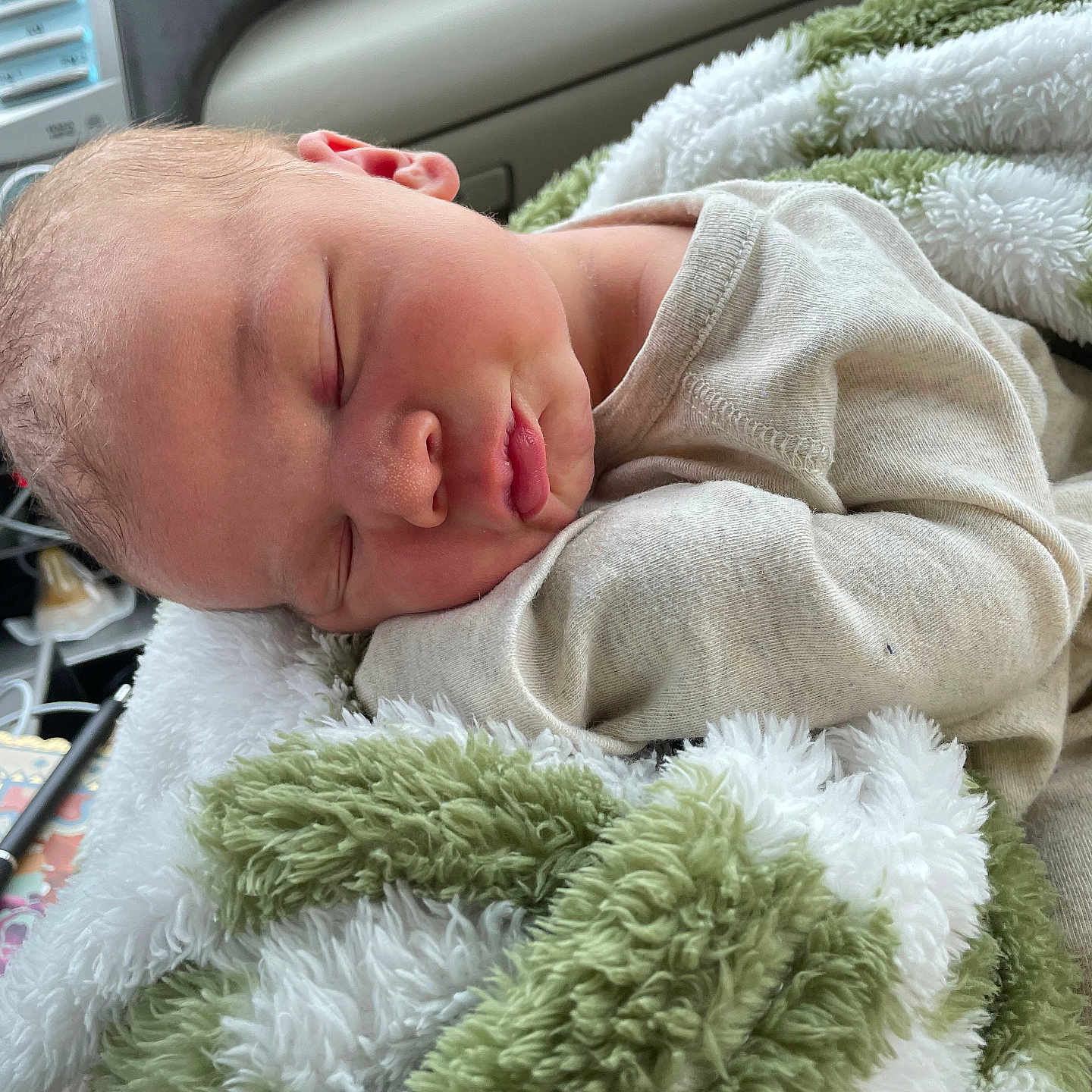 Tucker Lee is registered to the contest to win money with this photo: appliance, architecture, baby, blanket, building, device, electricaldevice, face, head, homedecor, hospital, newborn, pen, person, photography, portrait, quilt, sleeping, towel, washer