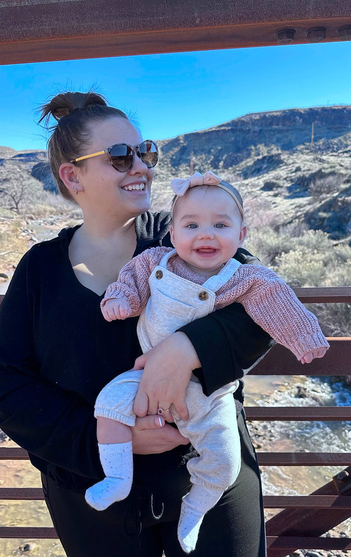 Lennon is registered to the contest to win money with this photo: azure, eyewear, facial_expression, fun, gesture, glasses, goggles, happy, joy, leaf, leisure, mountain, person, skin, sky, smile, standing, sunglasses, toddler, travel