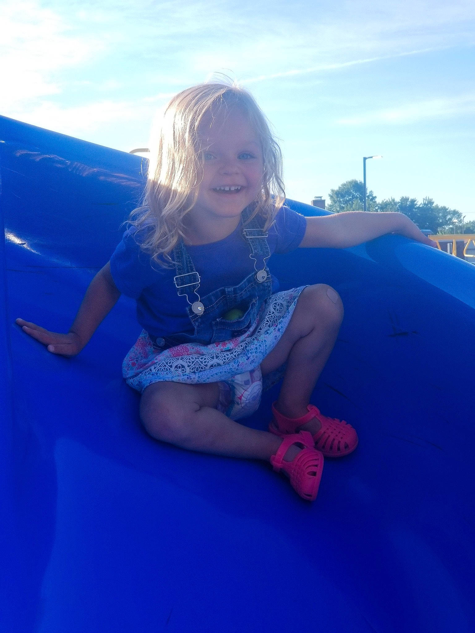 Selah joined the competition — help win amazing prizes! arm, blond, blue, child, cloud, cobalt_blue, electric_blue, fun, happy, joy, leg, leisure, long_hair, mountain, person, photography, sitting, sky, smile, summer
