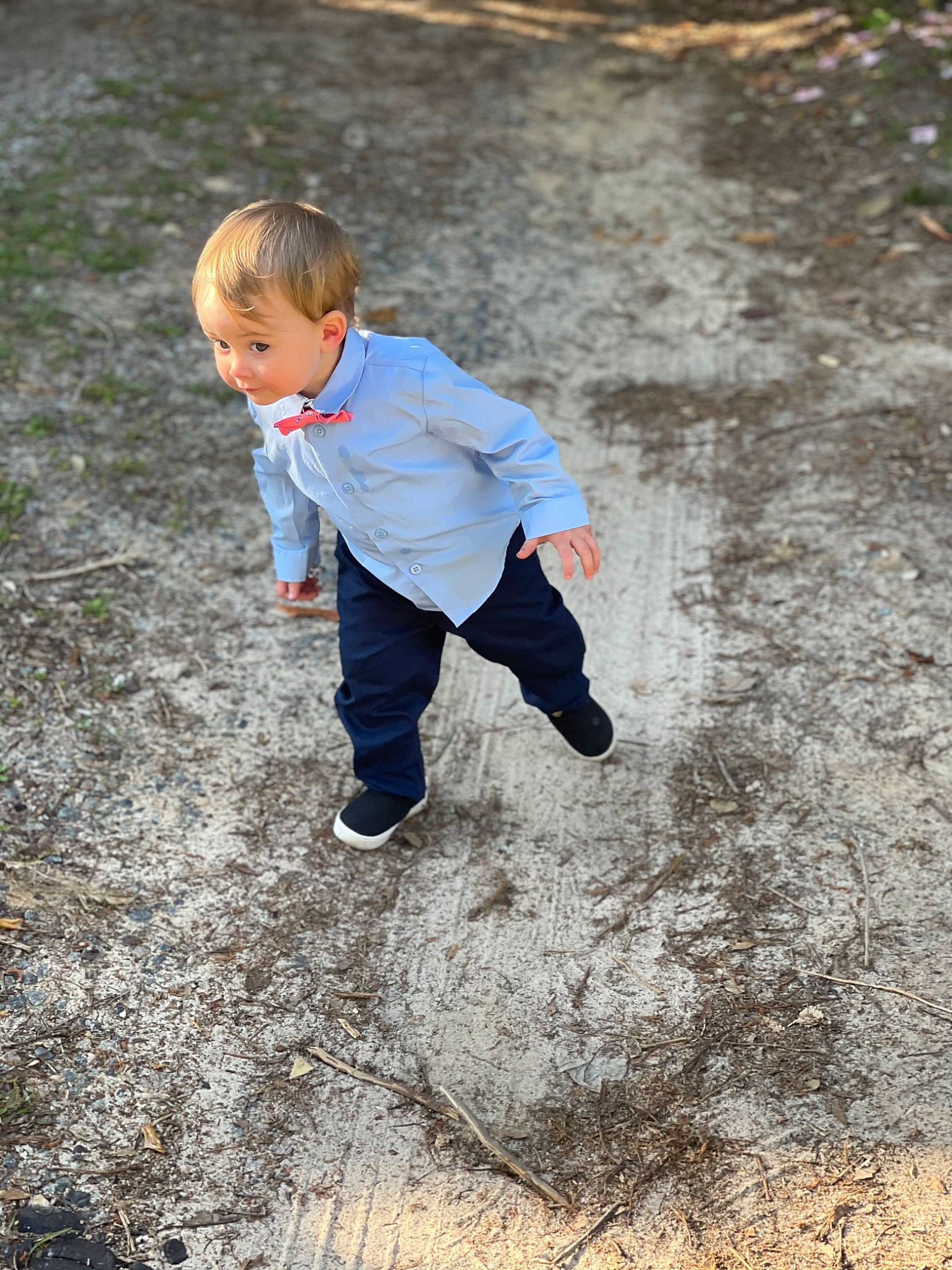 Andrew is registered to the contest to win money with this photo: asphalt, body_of_water, child, floor, flooring, fun, grass, happy, leg, people_in_nature, person, recreation, road_surface, sand, shoe, sidewalk, soil, toddler, tree, water
