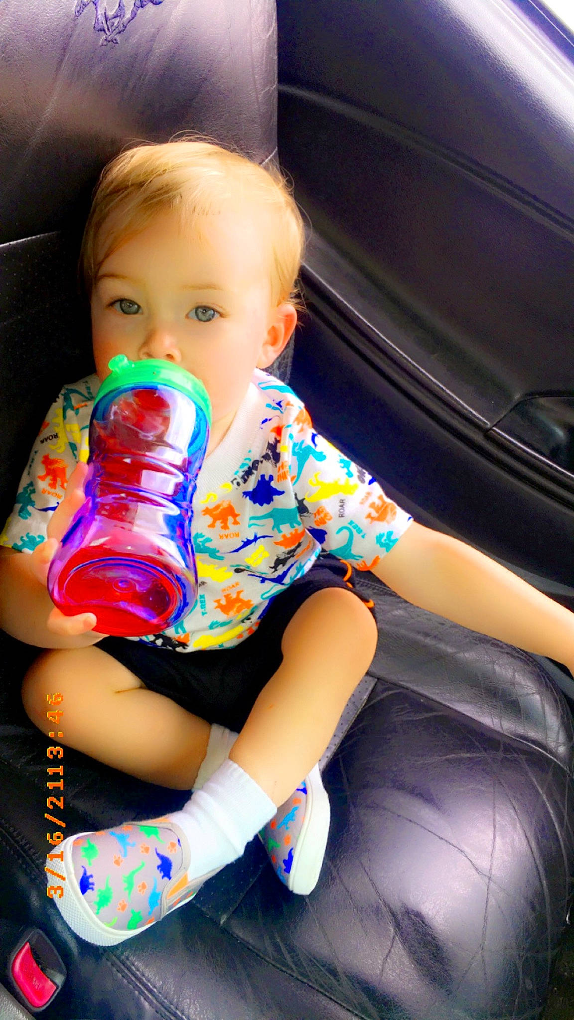 Andrew joined the competition — help win amazing prizes! automotive_design, automotive_exterior, baby, baby_products, baby_toddler_clothing, car_seat, child, drinkware, electric_blue, face, hairstyle, human_body, human_leg, knee, person, sitting, skin, t_shirt, thigh, toddler
