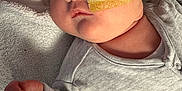 Olivia is registered to the contest to win money with this photo: baby, face, nasal_tube, tape, grey_clothing, blanket, infant, lying_down, skin, hand, expression, newborn, healthcare, medical, indoors, portrait, cute, child, soft_texture, closeup