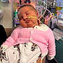 baby, sleeping, pink_sweater, onesie, medical_tube, hospital, newborn, person, infant, cute, care, hand, pajamas, indoor, healthcare, child, face, resting, knitted, treatment