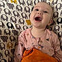Olivia joined the competition — help win amazing prizes! baby, infant, smiling, laughing, drooling, onesie, pink_clothing, elephant_pattern, patterned_background, orange_towel, baby_seat, close_up, portrait, indoor, happy, joyful, mouth_open, cheeks, fabric, adorable
