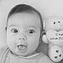 baby, bed, black_and_white, child, close_up, clothing, cute, expression, face, heart, indoors, infant, mouth_open, plush_toy, portrait, sleeping_area, soft_texture, teddy_bear, text, wide_eyes