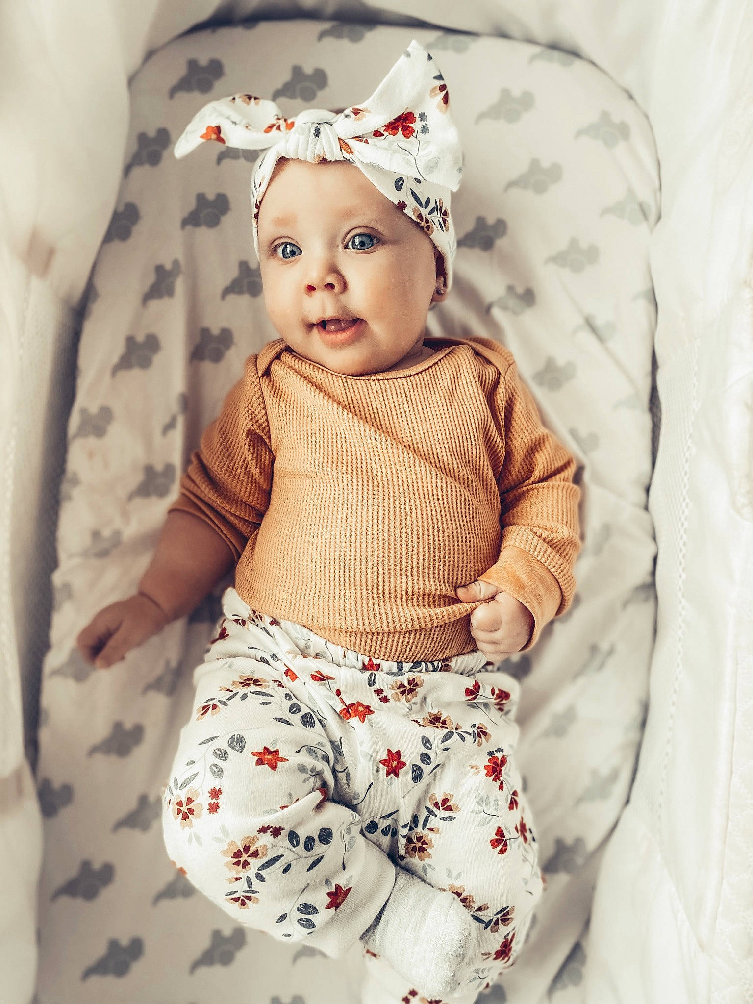 Graelyn joined the competition — help win amazing prizes! baby, baby_toddler_clothing, cap, collar, comfort, face, headwear, linens, lip, neck, outerwear, pattern, person, product, sitting, skin, sleeve, t_shirt, textile, toddler