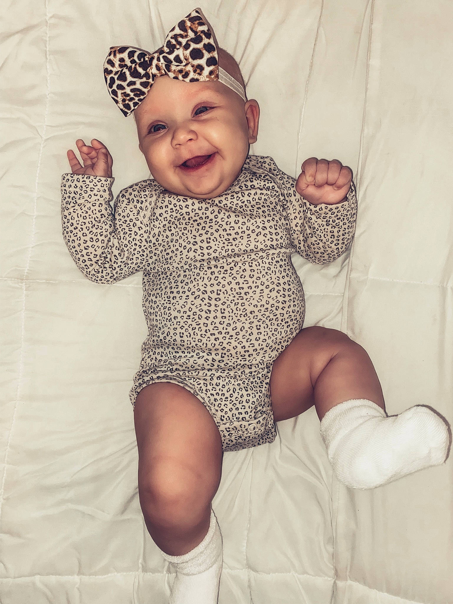 Graelyn is registered to the contest to win money with this photo: baby, baby_laughing, baby_toddler_clothing, bonnet, child, comfort, costume_accessory, facial_expression, finger, hair_accessory, headpiece, headwear, joy, laugh, pattern, person, polka_dot, sock, toddler