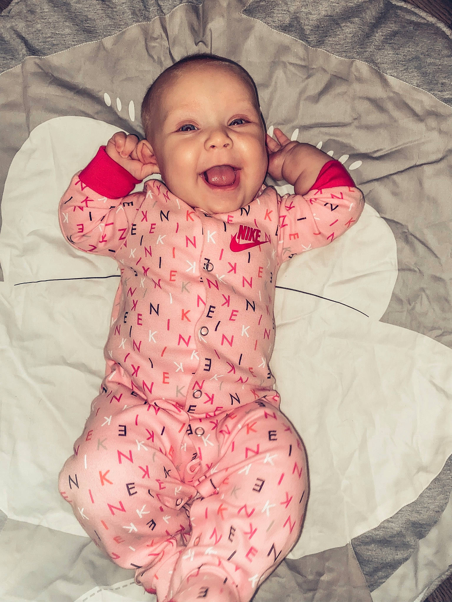 Graelyn joined the competition — help win amazing prizes! baby, baby_products, baby_toddler_clothing, cheek, child, comfort, face, facial_expression, human, laugh, linens, lip, mouth, nightwear, nose, person, pink, skin, sleeve, toddler
