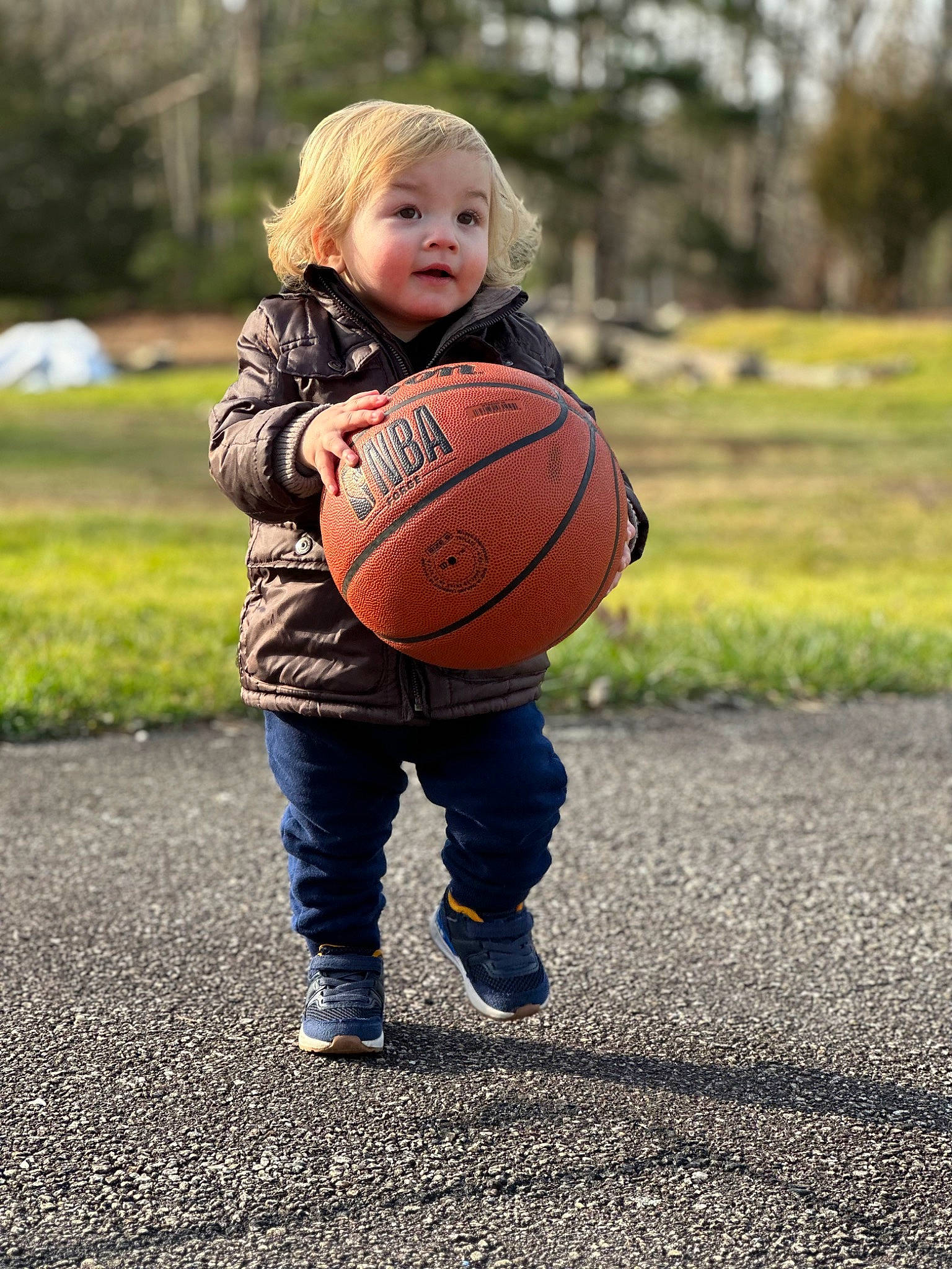 Eli joined the competition — help win amazing prizes! ball, ball_game, basketball, child, face, grass, happy, leisure, orange, people_in_nature, person, plant, playing_with_kids, shoe, sneakers, sports_equipment, sports_toy, streetball, team_sport, toddler