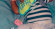 Jakardier joined the competition — help win amazing prizes! baby, sleeping, pacifier, bib, striped_clothing, pajamas, cartoon_print, blanket, blue, pink, heart, text_overlay, cute, infant, child, cozy, resting, indoors, soft_lighting, peaceful