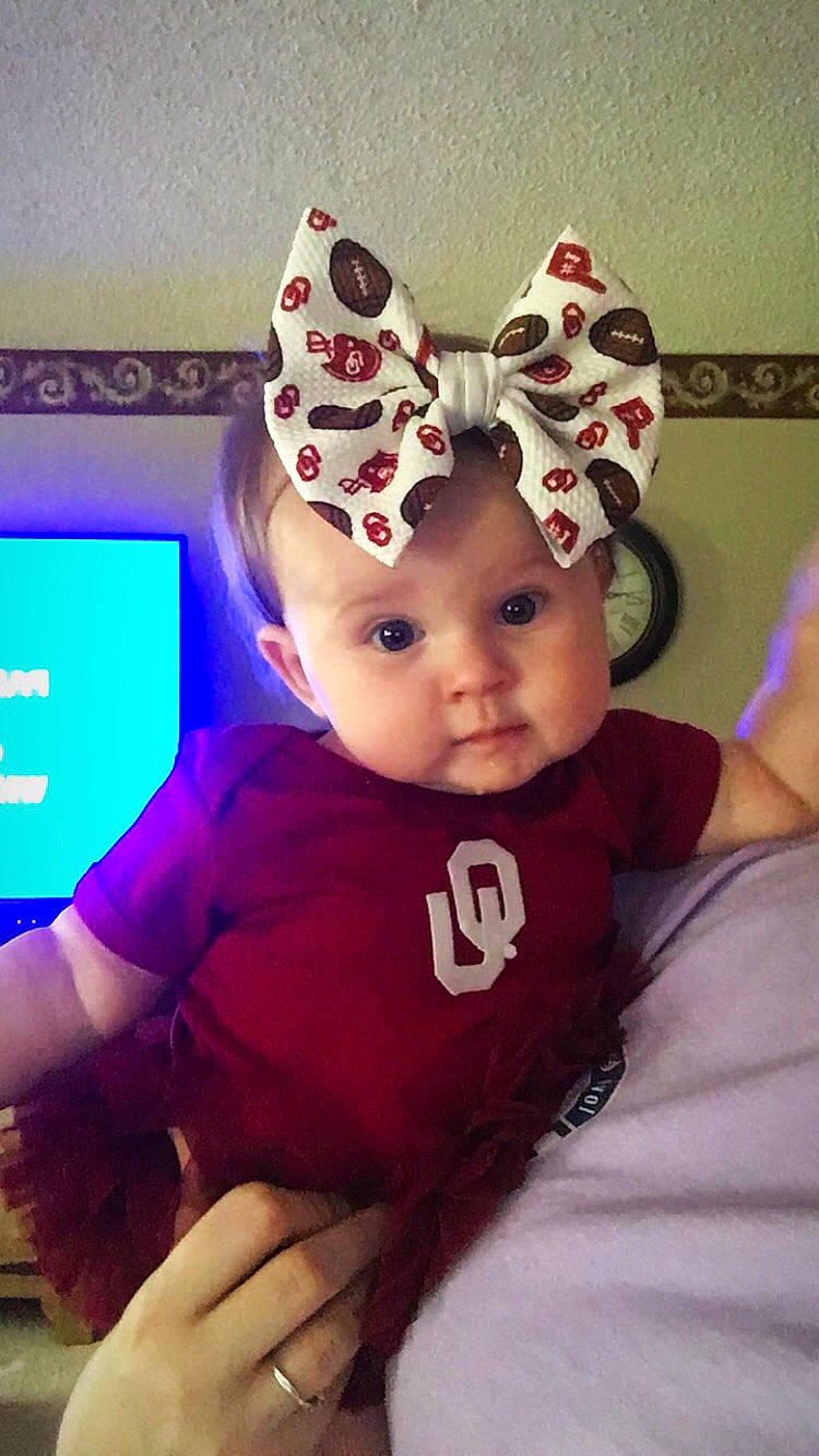 Chevelle is registered to the contest to win money with this photo: baby, cheek, child, cool, ear, eye, face, fawn, fun, hair_accessory, head, headgear, headwear, nose, organ, person, pink, toddler