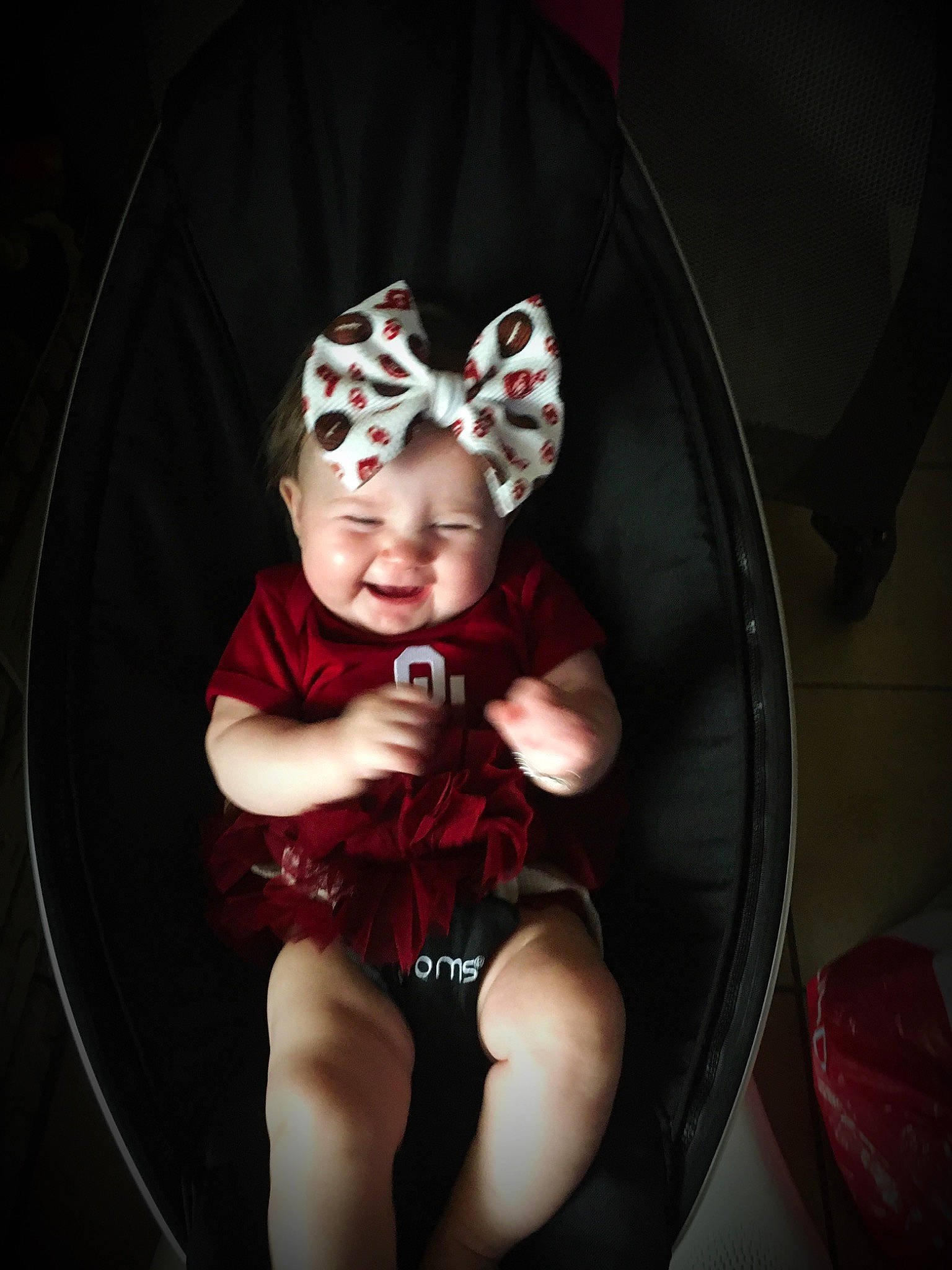 Chevelle is registered to the contest to win money with this photo: baby, baby_toddler_clothing, cheek, child, ear, eye, fashion_accessory, hair_accessory, hat, headgear, headpiece, headwear, joy, person, photography, product, red, sitting, smile, toddler