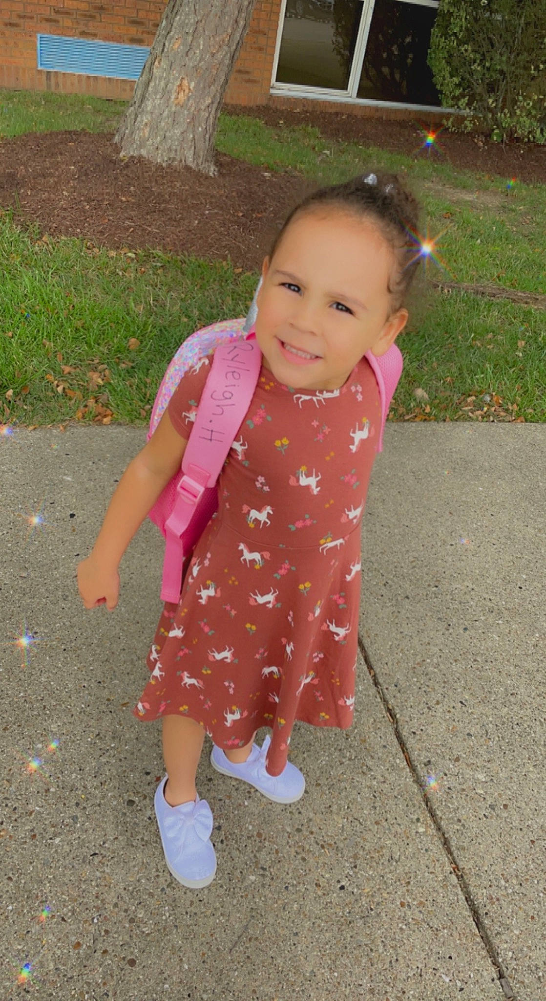Ryleigh is registered to the contest to win money with this photo: asphalt, baby, baby_toddler_clothing, child, dress, fun, grass, happy, joy, leisure, magenta, pattern, people_in_nature, person, pink, plant, road_surface, sidewalk, sleeve, smile