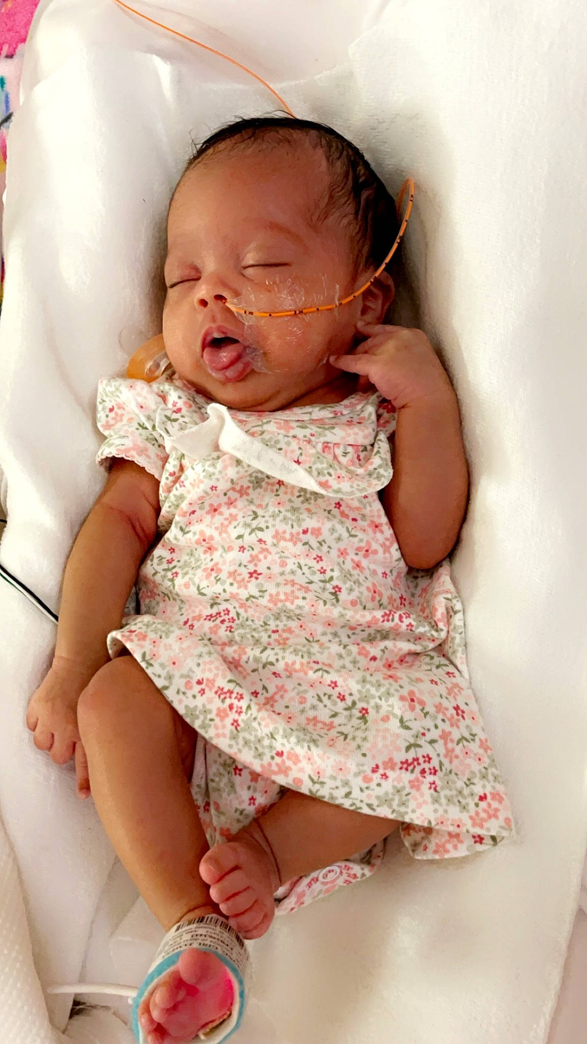 Skylar is registered to the contest to win money with this photo: arm, baby, baby_toddler_clothing, cheek, child, clothing, comfort, finger, hand, happy, iris, lip, mouth, neck, person, pink, skin, sleeve, thigh, toddler