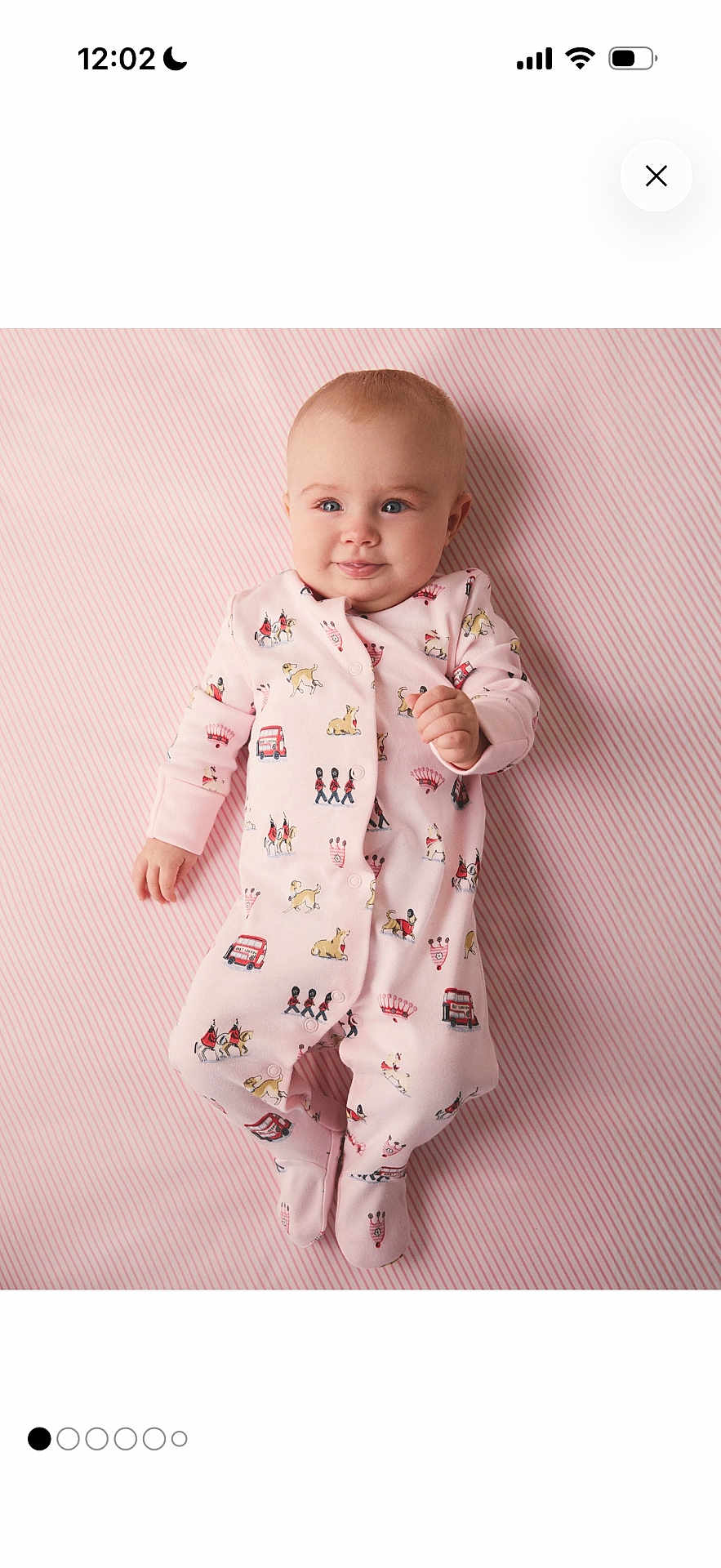 Ilhan joined the competition — help win amazing prizes! baby, bus_print, child, chubby_cheeks, cute, fabric_pattern, feet, footed_pajamas, hands, infant, lying_down, nursery, onesie, pink, portrait, product_photo, smiling, soft_lighting, striped_background, studio_photo