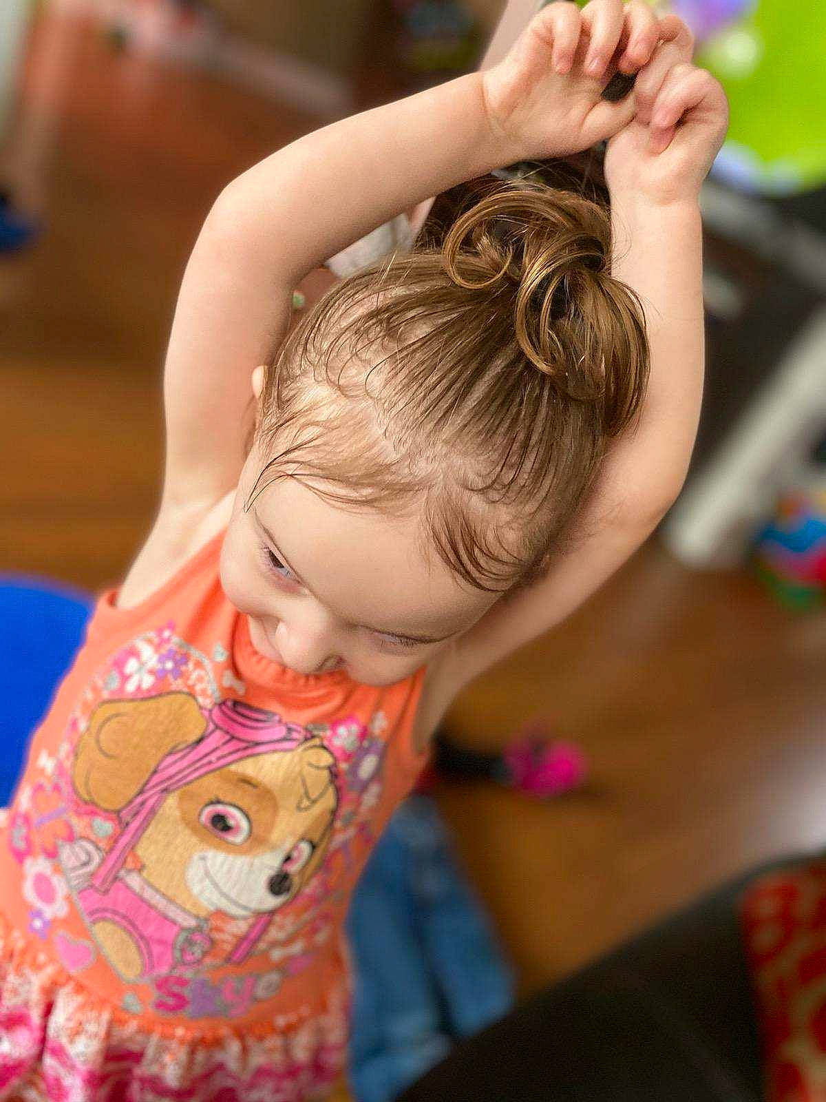 Lilliana is registered to the contest to win money with this photo: bangs, black_hair, brown_hair, child, chin, ear, eyelash, finger, fun, hair, happy, joint, leisure, long_hair, neck, person, recreation, shoulder, skin, t_shirt