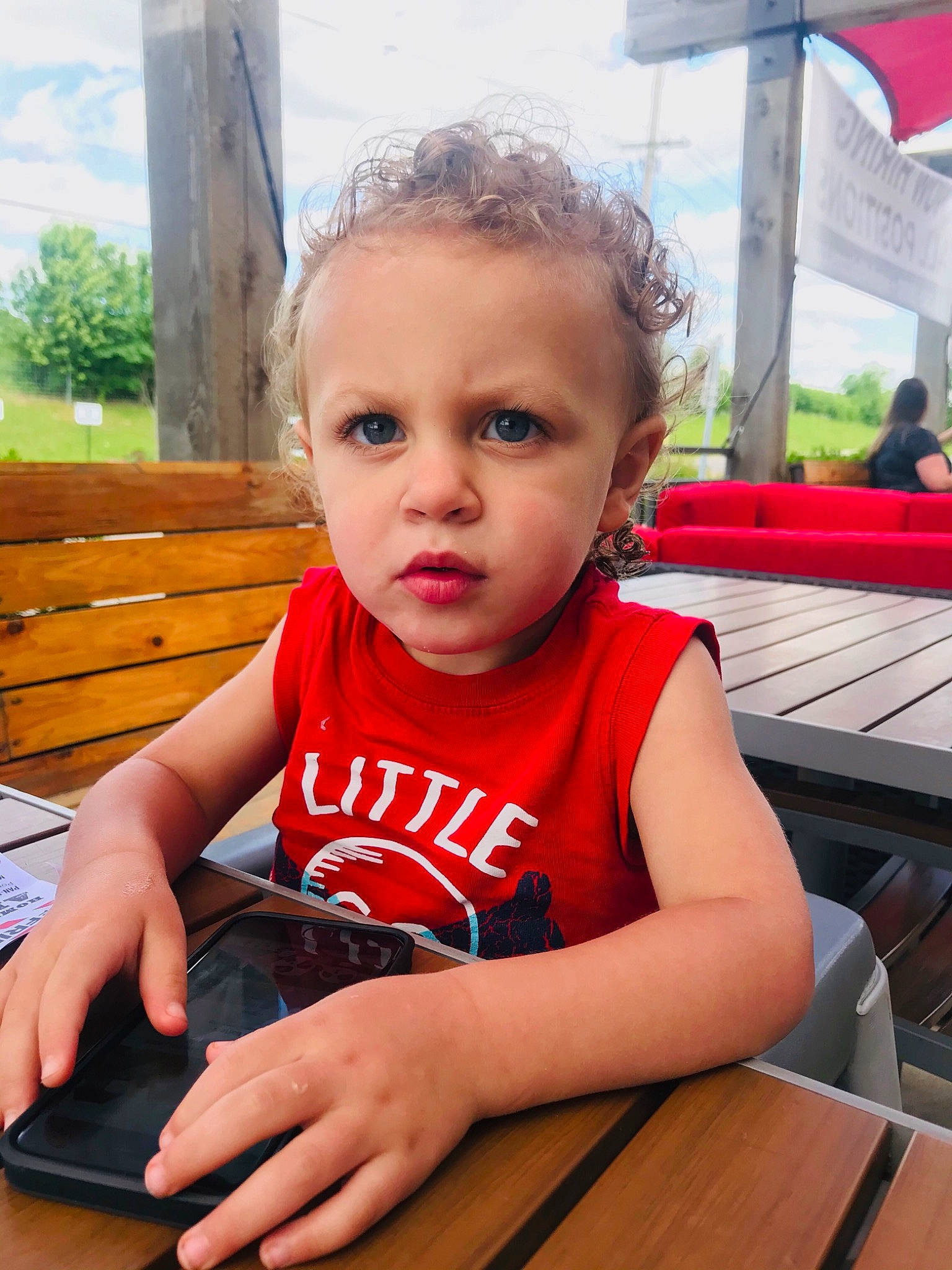 Kacee is registered to the contest to win money with this photo: baby_toddler_clothing, chair, child, desk, finger, fun, grass, hairstyle, hand, happy, leisure, person, plant, recreation, sitting, skin, smile, table, thumb, toddler