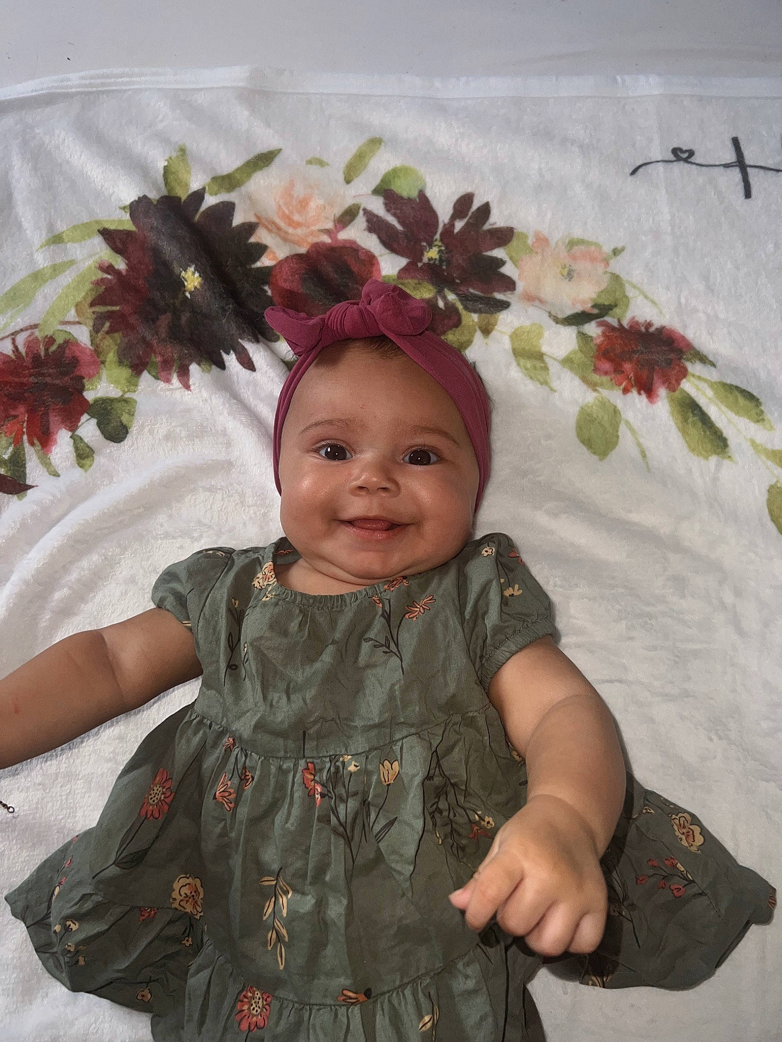 Ivy Rose is registered to the contest to win money with this photo: baby, baby_toddler_clothing, beauty, child, cut_flowers, fashion_accessory, floral_design, flower, flower_arranging, happy, headgear, headpiece, joy, pattern, person, petal, pink, plant, sleeve, smile