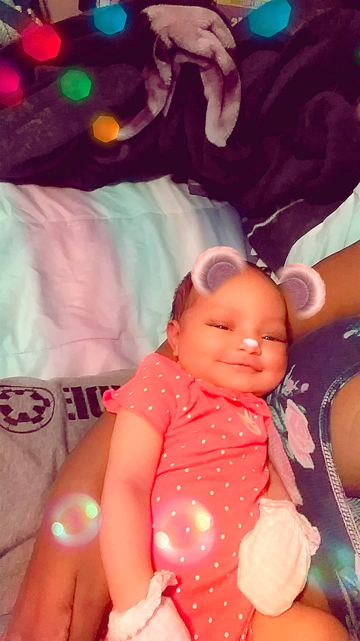 Za'Ryah is registered to the contest to win money with this photo: abdomen, black_hair, cheek, child, finger, fun, girl, hand, happiness, head, human_hair_color, infant, iris, mouth, person, pink, product, skin, smile, toddler